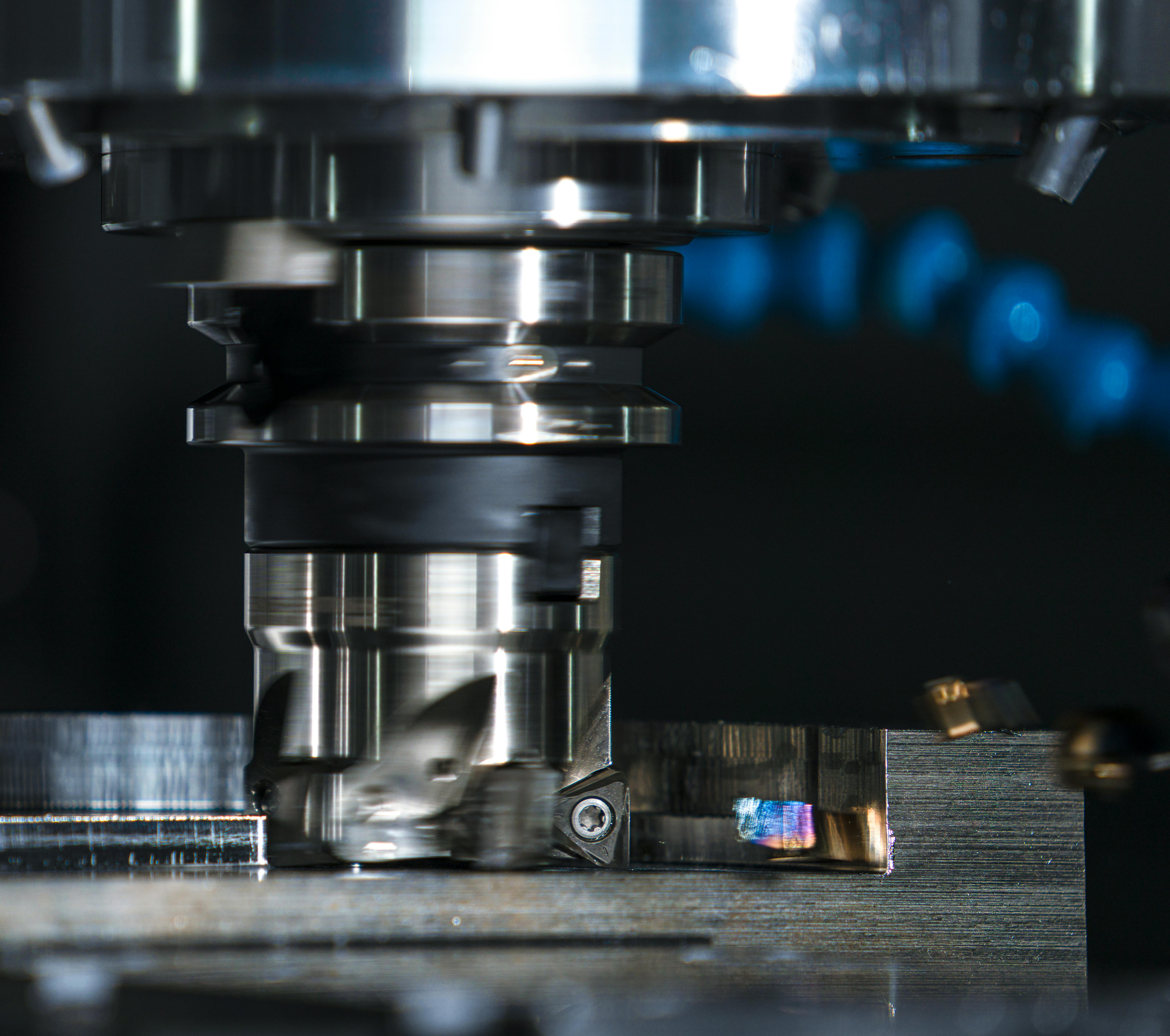 Close-up photo of a CNC milling cutter machining metal